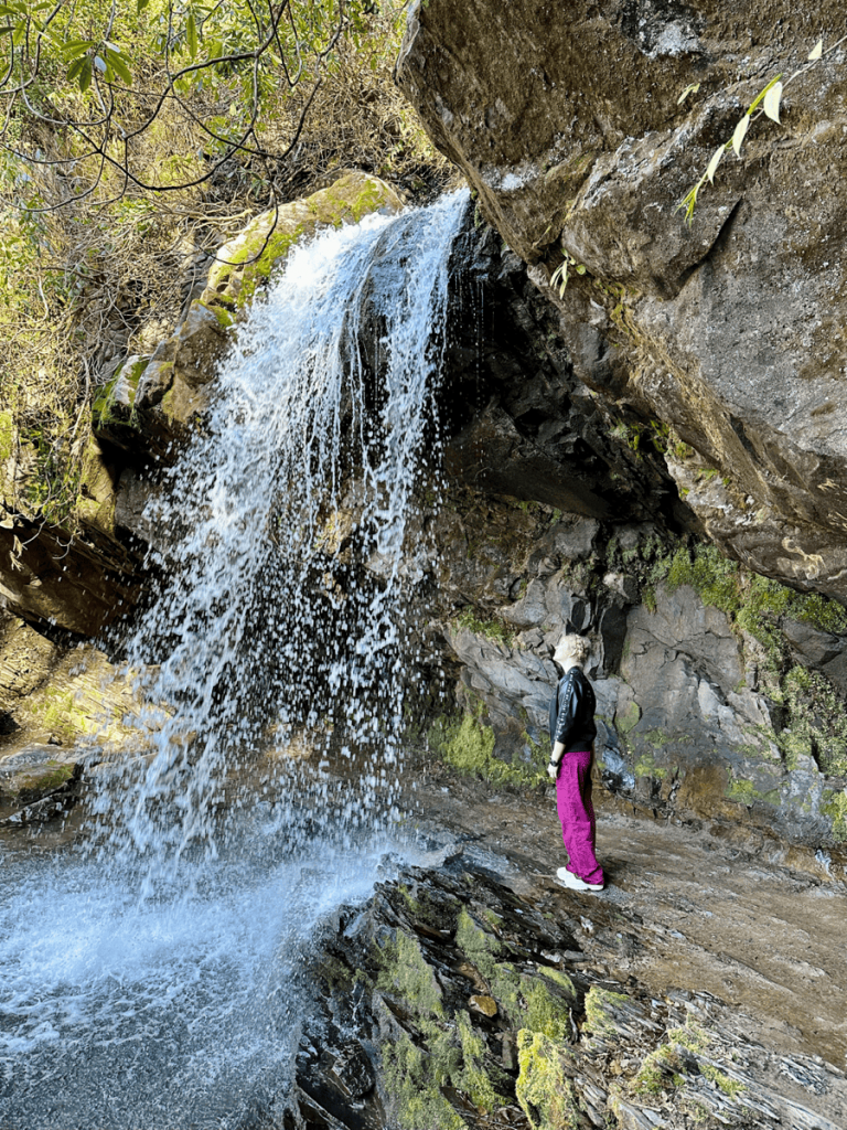 Grotto Falls Trail lies behind the waterfall